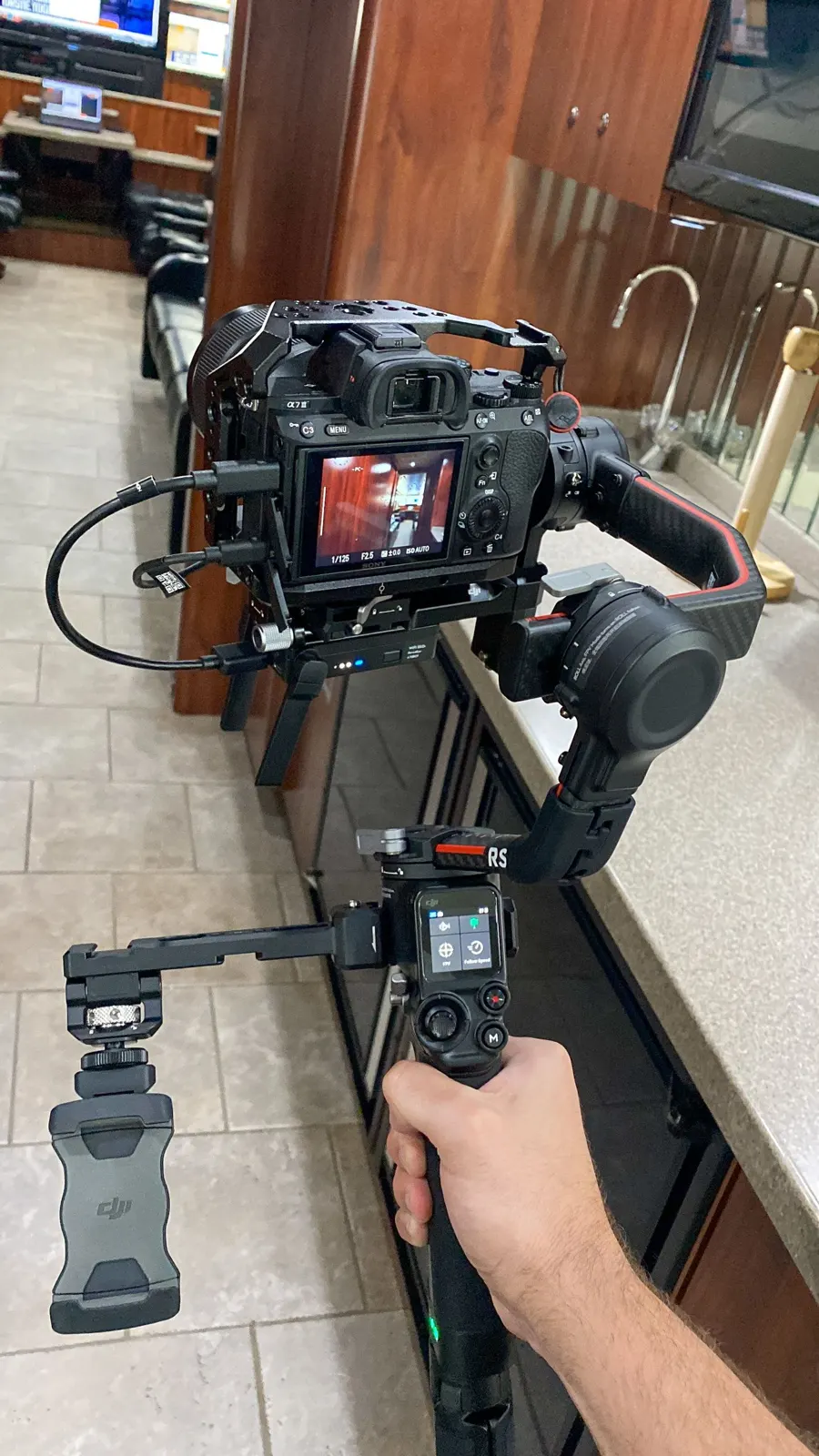 A camera on a gimbal, ready for a moving shot