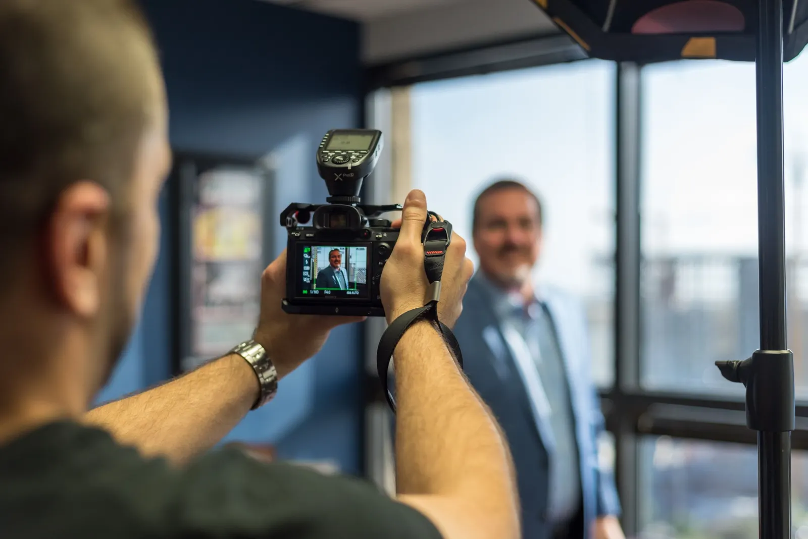 Our photographer shooting a business portrait in a client's office