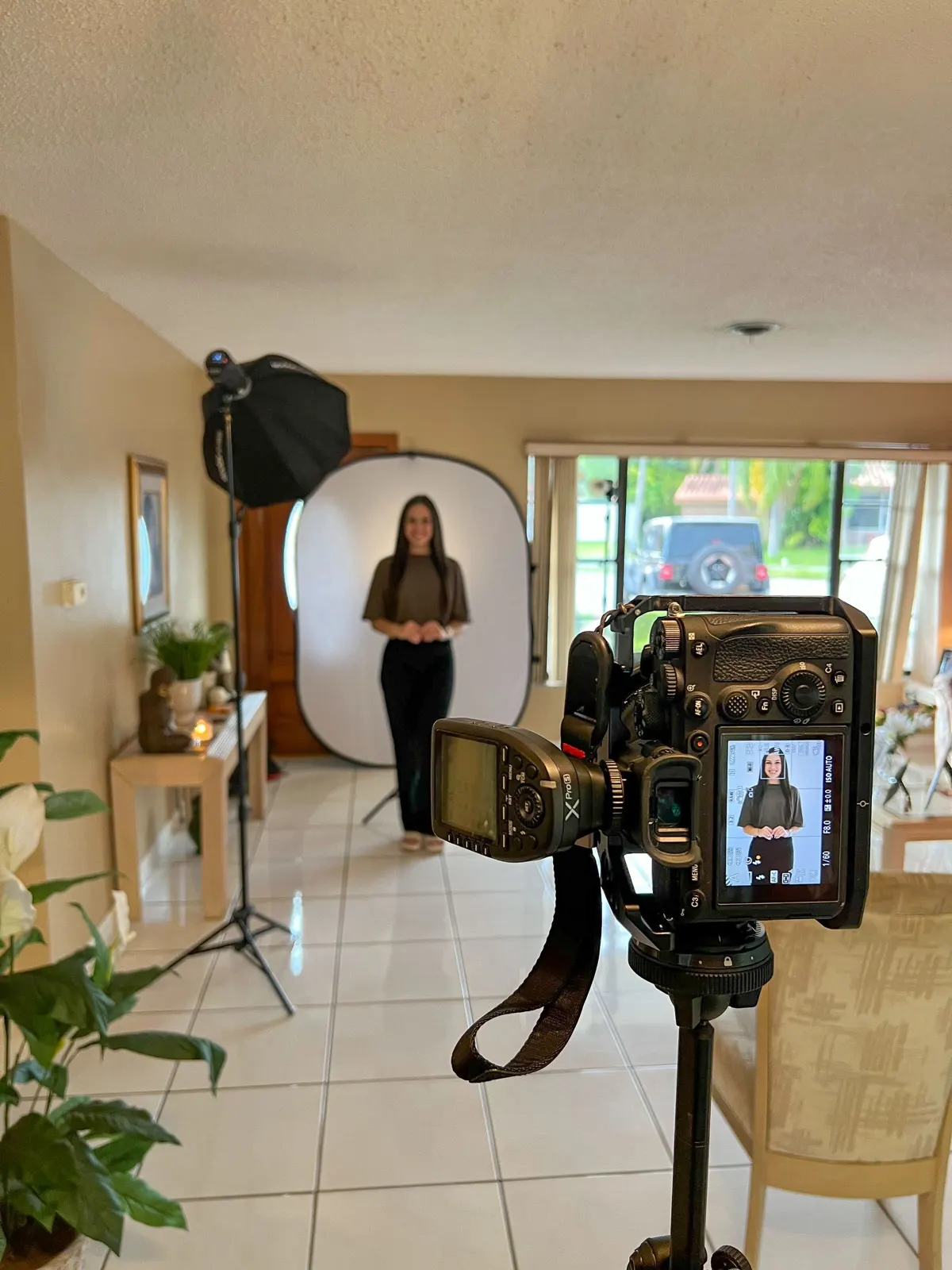 A portrait set with a backdrop and a camera showing the live frame