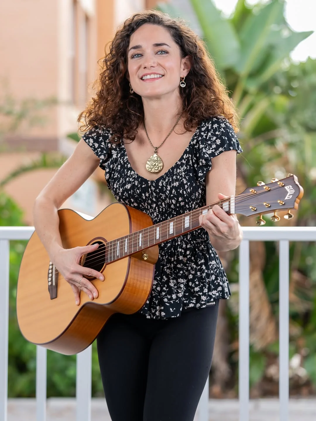 A musician with her guitar, from a personal brand shoot we posted on our Instagram