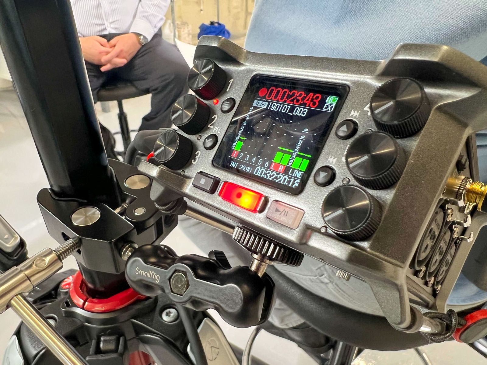 Field audio recorder running levels during an interview take