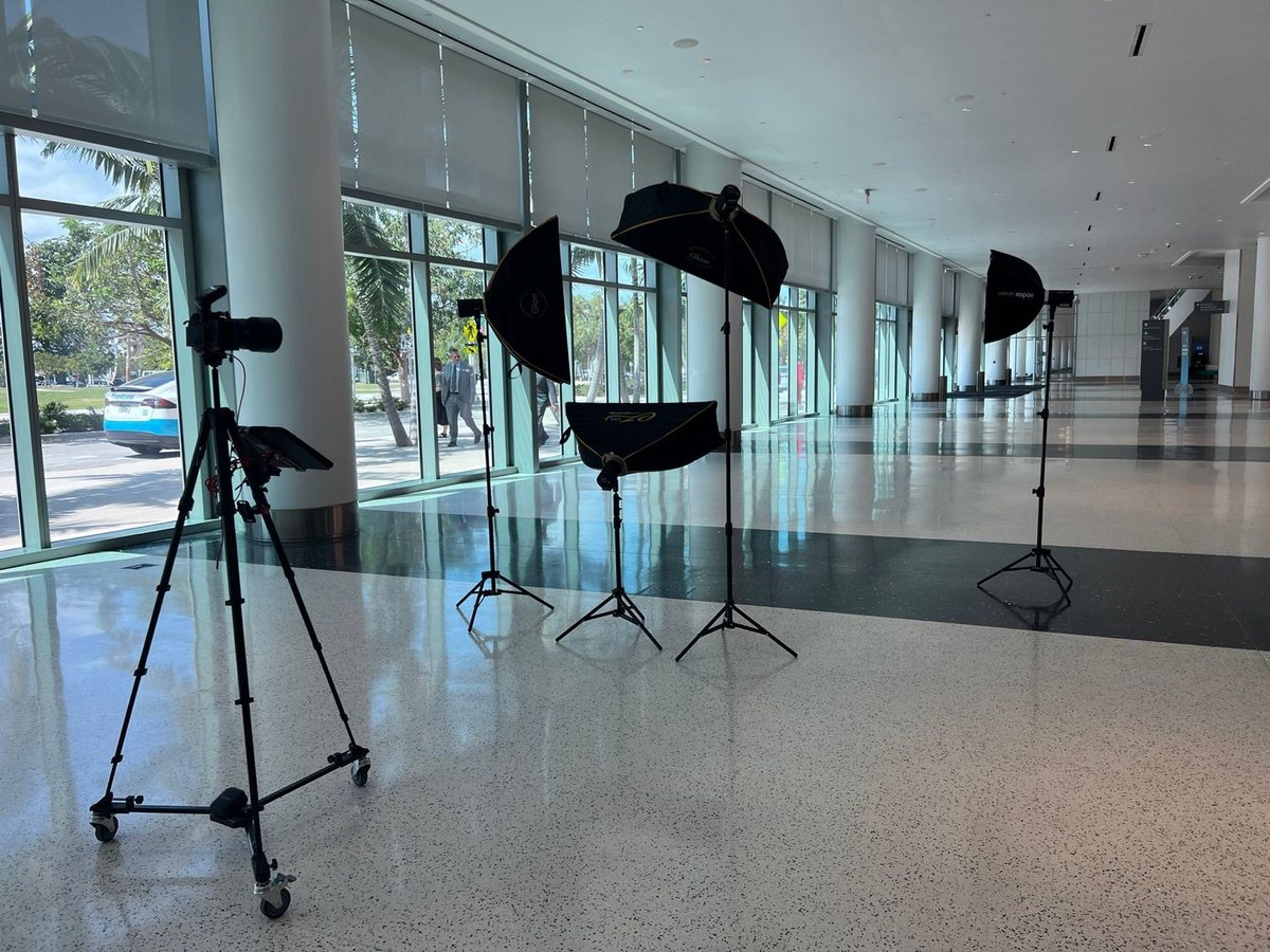 Lights and softboxes set up in an empty studio space