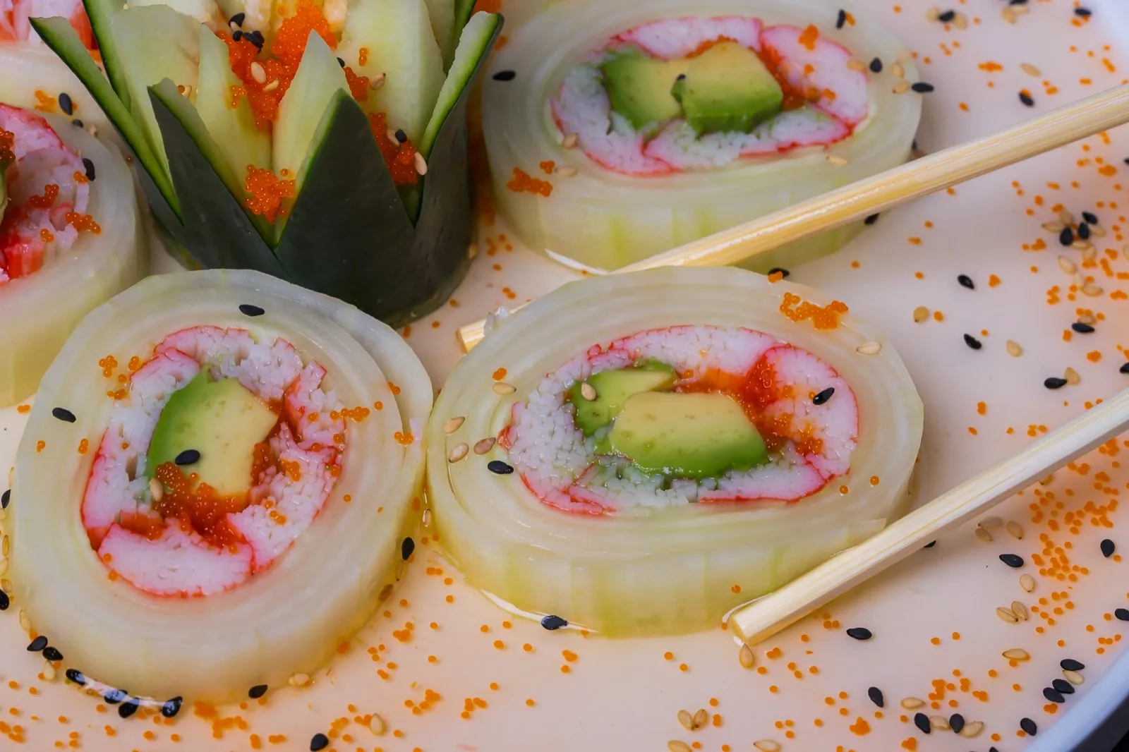 Cucumber-wrapped roll with avocado and roe