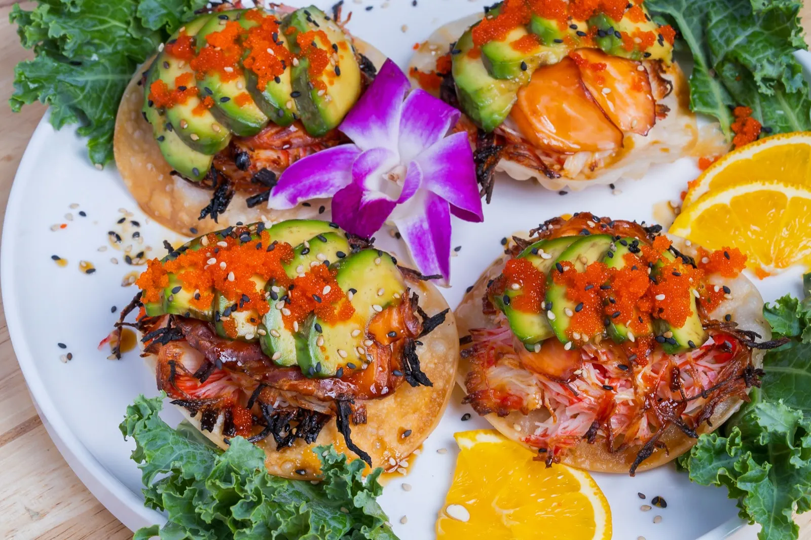 Crab and avocado tostadas with orange and roe