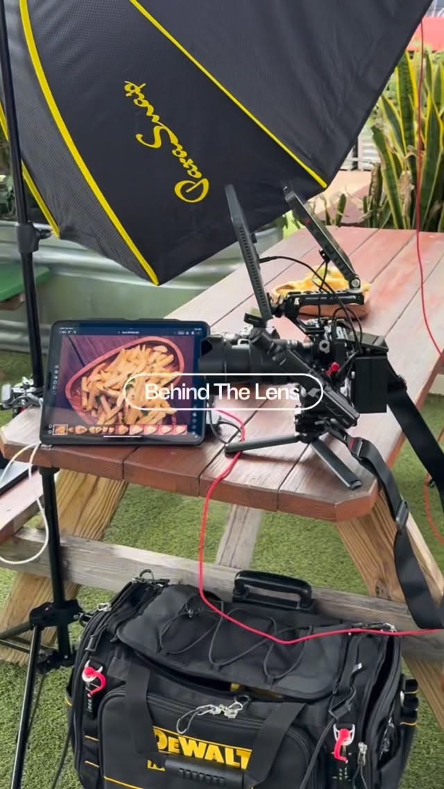 Camera rig and tethered monitor set up over a food shoot