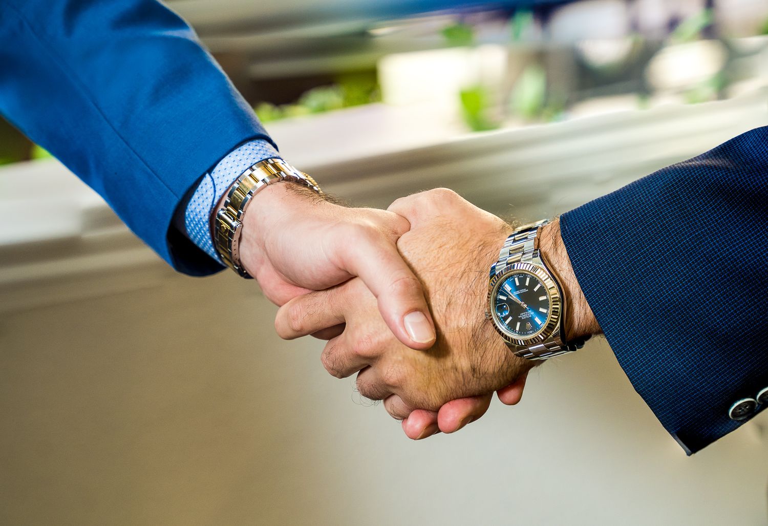 Close up of two business partners shaking hands to close a deal
