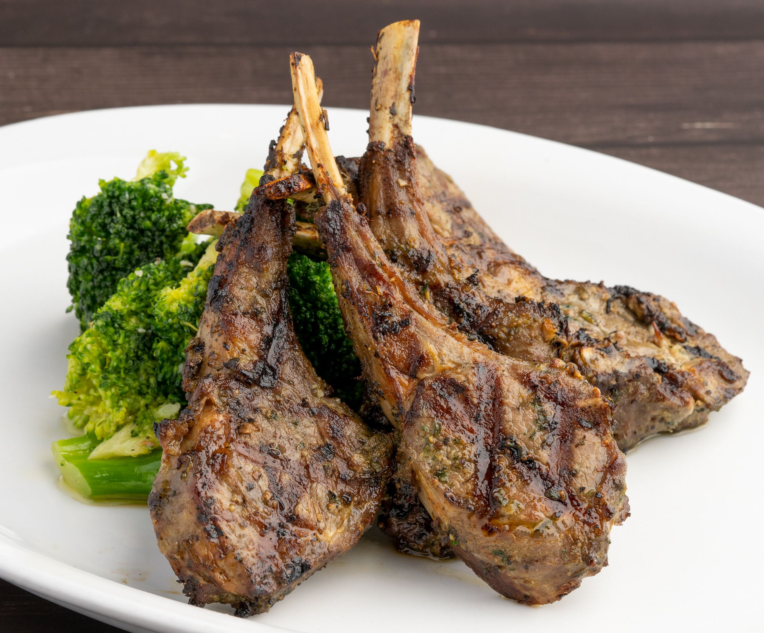 Grilled lamb chops plated with broccolini