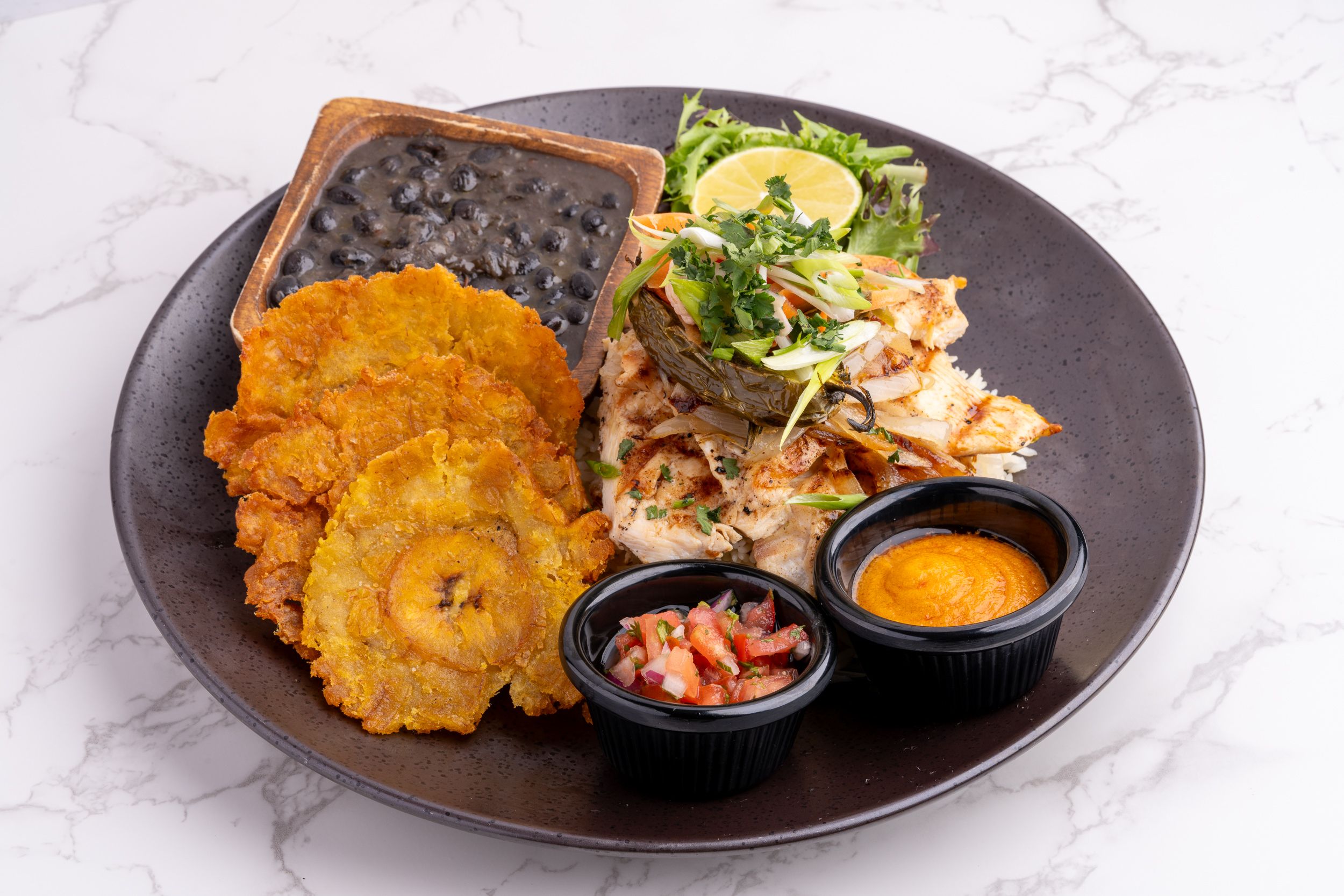 Tostones plate with dipping sauces