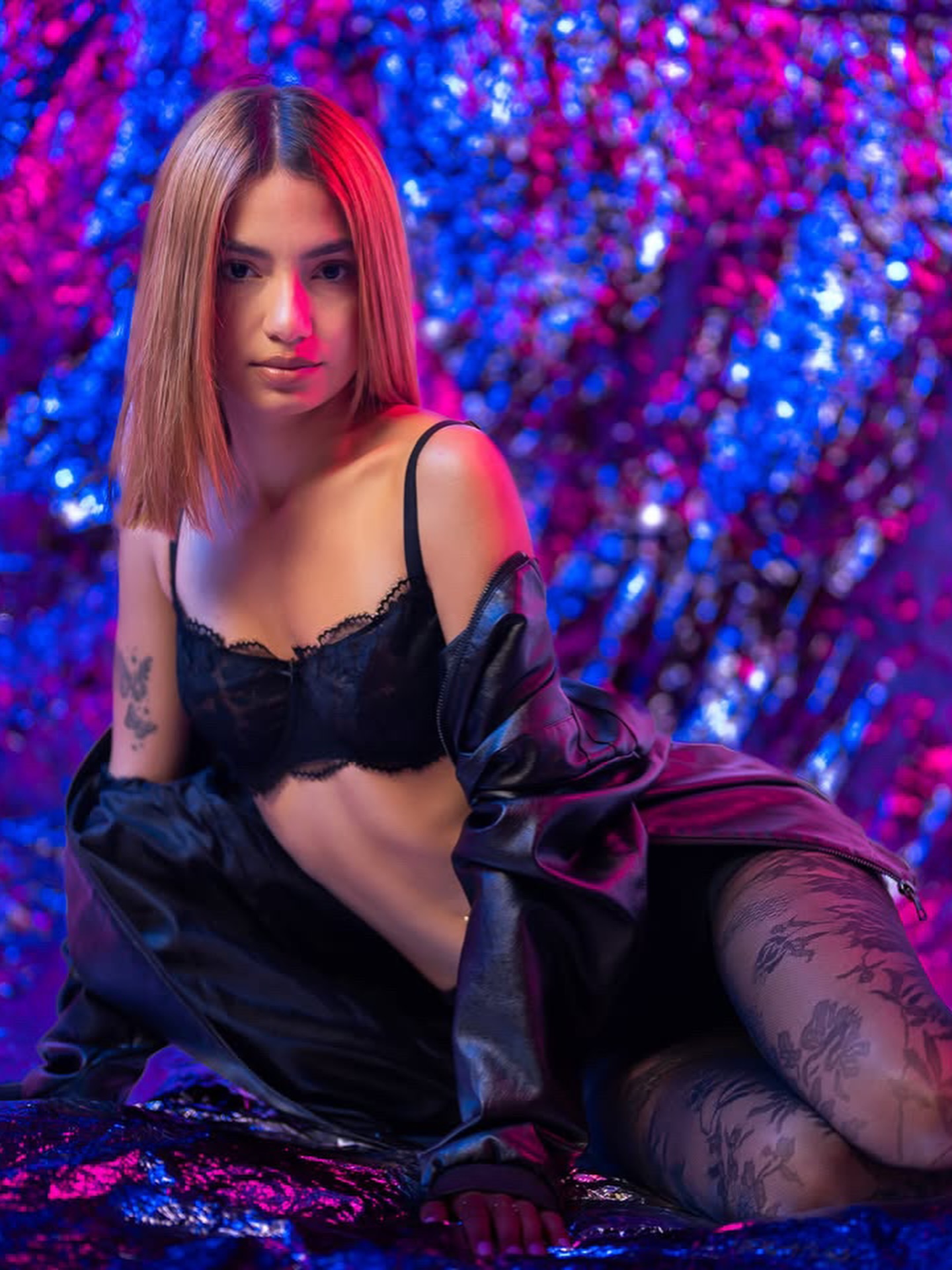 Editorial model portrait with neon red lighting